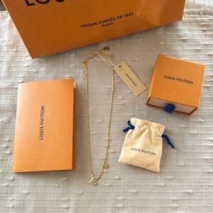 LOUIS VUITTON Iconic Necklace, gold metal and crystal logo with small flower.